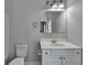 Neutral bathroom featuring double sinks, white cabinetry, and a clean, modern design at 73 Atlanta Sw Ave, Atlanta, GA 30315