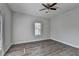 Neutral bedroom featuring hardwood floors, ceiling fan, natural light, and a calming atmosphere at 73 Atlanta Sw Ave, Atlanta, GA 30315