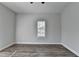 Minimalist bedroom with wood flooring and a bright window provides a clean, versatile space at 73 Atlanta Sw Ave, Atlanta, GA 30315