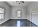 An empty bedroom showcasing hardwood floors, white walls, natural light, and simple elegance, ready for personalization at 73 Atlanta Sw Ave, Atlanta, GA 30315