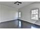 Spacious bedroom features a ceiling fan, natural light, and hardwood floors at 73 Atlanta Sw Ave, Atlanta, GA 30315