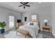 Inviting bedroom with neutral tones, modern ceiling fan, and access to an outdoor patio at 73 Atlanta Sw Ave, Atlanta, GA 30315