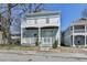 Charming two-story home featuring a welcoming front porch and an upper-level balcony, perfect for enjoying outdoor living at 73 Atlanta Sw Ave, Atlanta, GA 30315