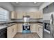 Cozy kitchen features stainless steel appliances and tiled floors for a modern, easy-to-clean space at 73 Atlanta Sw Ave, Atlanta, GA 30315