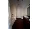 Bathroom featuring a vanity with granite counters, a tub, and hardwood floors at 7563 Avalon Blvd # 305, Fairburn, GA 30213