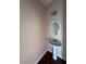 Compact half-bathroom features pedestal sink and modern lighting at 7563 Avalon Blvd # 305, Fairburn, GA 30213