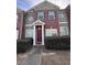 Charming two-story home features brick facade, neutral siding, and manicured landscaping at 7563 Avalon Blvd # 305, Fairburn, GA 30213