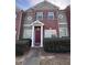 Charming brick townhome featuring well-manicured landscaping at 7563 Avalon Blvd # 305, Fairburn, GA 30213
