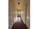 Hallway featuring multiple doors and wood-look flooring at 7563 Avalon Blvd # 305, Fairburn, GA 30213