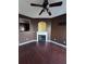 Spacious living room boasts hardwood floors and a cozy fireplace with modern mantel at 7563 Avalon Blvd # 305, Fairburn, GA 30213