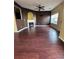 Open living room area with hardwood floors, fireplace, and plenty of natural light at 7563 Avalon Blvd # 305, Fairburn, GA 30213