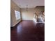 Bright living space with hardwood floors and staircase access to the second floor at 7563 Avalon Blvd # 305, Fairburn, GA 30213