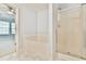 Bright and modern bathroom featuring a soaking tub, shower, and neutral flooring at 1526 Viero Dr, Lawrenceville, GA 30044