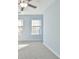 Bright bedroom with a ceiling fan and two windows, creating a comfortable and airy retreat at 1526 Viero Dr, Lawrenceville, GA 30044