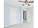 Bright bedroom with a ceiling fan and neutral carpet with easy access to other rooms at 1526 Viero Dr, Lawrenceville, GA 30044