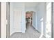 Bright foyer with wood-look flooring, neutral walls, and an arched doorway leading to living spaces at 1526 Viero Dr, Lawrenceville, GA 30044