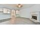 Bright living room with fireplace and archways that connect to the dining area, creating an inviting space at 1526 Viero Dr, Lawrenceville, GA 30044