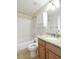 Bathroom featuring granite counters, framed mirror and shower-tub combo at 10375 Plantation Bridge Dr, Johns Creek, GA 30022