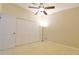 Bedroom with closet, ceiling fan, and carpet at 10375 Plantation Bridge Dr, Johns Creek, GA 30022