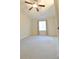 Carpeted bedroom with ceiling fan and window at 10375 Plantation Bridge Dr, Johns Creek, GA 30022