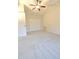 Spacious carpeted bedroom features ceiling fan at 10375 Plantation Bridge Dr, Johns Creek, GA 30022