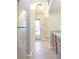 Kitchen area with stainless steel refrigerator and view of the entryway at 10375 Plantation Bridge Dr, Johns Creek, GA 30022