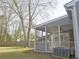 Exterior view showcasing the screened-in porch, offering a relaxing space with backyard scenery at 10375 Plantation Bridge Dr, Johns Creek, GA 30022