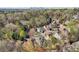 Scenic aerial view of homes nestled among trees with the city skyline in the distance at 1056 Shady Valley Ne Pl, Brookhaven, GA 30324