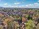 Wide aerial shot of a suburban neighborhood surrounded by lush greenery and city skyline at 1056 Shady Valley Ne Pl, Brookhaven, GA 30324