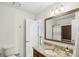 Full bath featuring a tiled shower, granite countertops, and a sink with chrome finishes at 1056 Shady Valley Ne Pl, Brookhaven, GA 30324