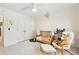 Bedroom featuring hardwood floors, natural light, modern ceiling fan, and plantation shutters at 1056 Shady Valley Ne Pl, Brookhaven, GA 30324