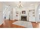 Spacious living room featuring built-in shelves, a fireplace, and hardwood floors at 1056 Shady Valley Ne Pl, Brookhaven, GA 30324