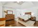 Main bedroom with hardwood floors, modern decor, and ensuite bathroom at 1056 Shady Valley Ne Pl, Brookhaven, GA 30324