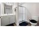 Well-lit bathroom featuring a white vanity with drawers and a shower with sliding doors for a modern look at 120 Chastain Nw Rd # 1204, Kennesaw, GA 30144