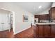 Open kitchen view with granite countertops, stainless appliances, and a breakfast bar at 120 Chastain Nw Rd # 1204, Kennesaw, GA 30144