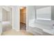 Bright bathroom with soaking tub and walk in closet at 1909 Sawgrass Dr, Hampton, GA 30228