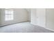 Bedroom with plush gray carpeting and ample natural light at 1909 Sawgrass Dr, Hampton, GA 30228