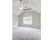 Bright bedroom features a ceiling fan and a large arched window at 1909 Sawgrass Dr, Hampton, GA 30228