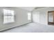 Bedroom features two windows and neutral paint at 1909 Sawgrass Dr, Hampton, GA 30228