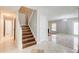 Inviting entryway with tiled floors and stairs to the second level at 1909 Sawgrass Dr, Hampton, GA 30228