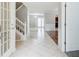 Open foyer showcasing tile flooring, staircase, and adjacent dining area at 1909 Sawgrass Dr, Hampton, GA 30228