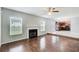 Inviting living room with a fireplace and hardwood floors, great for entertaining at 1909 Sawgrass Dr, Hampton, GA 30228