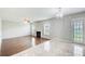 Living room featuring a fireplace, hardwood floors, and natural lighting at 1909 Sawgrass Dr, Hampton, GA 30228