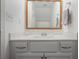 Bright bathroom with white vanity, framed mirror, and modern fixtures at 1101 Collier Nw Rd # V3, Atlanta, GA 30318