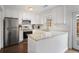 Modern kitchen featuring white cabinets, stainless steel appliances, and granite countertops at 1101 Collier Nw Rd # V3, Atlanta, GA 30318