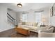 Cozy living room featuring hardwood floors, a light sofa, and natural light from large windows at 1101 Collier Nw Rd # V3, Atlanta, GA 30318