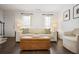 Inviting living room featuring hardwood floors, white walls, and bright natural light at 1101 Collier Nw Rd # V3, Atlanta, GA 30318