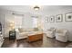 Bright living room featuring hardwood floors, a light sofa, and natural light from large windows at 1101 Collier Nw Rd # V3, Atlanta, GA 30318