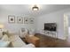 Inviting living room featuring hardwood floors, white walls, and bright natural light at 1101 Collier Nw Rd # V3, Atlanta, GA 30318
