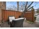 Patio with seating, privacy fence, and mature trees at 1101 Collier Nw Rd # V3, Atlanta, GA 30318